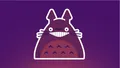 Illustration of Totoro grinning, sticker-style, on a purple background.