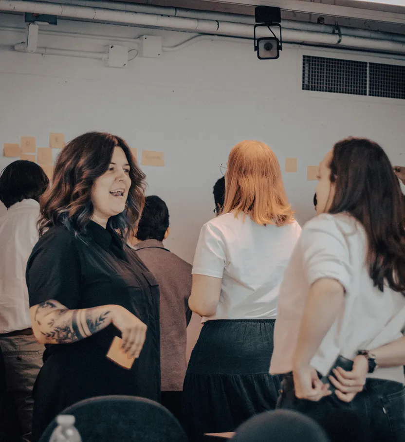 Facilitating a group discussion at a sticky-note wall